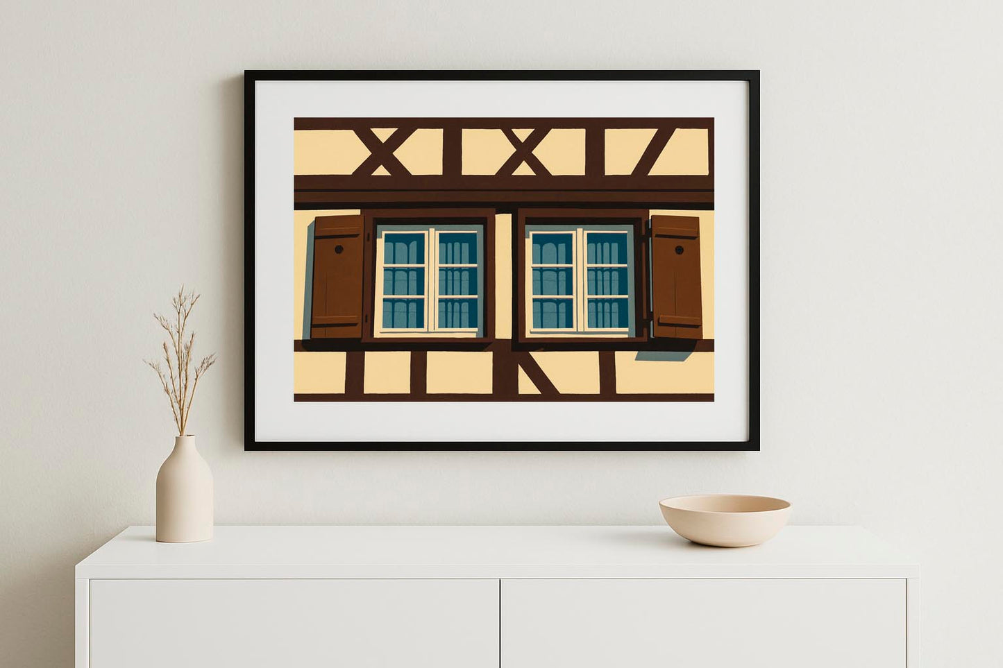 Lámina decorativa Ventanas de Estrasburgo enmarcada en negro sobre aparador blanco minimalista con jarrón y cuenco, decoración de salón nórdico IMAJIN-ARTE